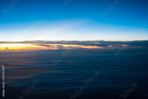 Sunset with blue sky view from airplane window