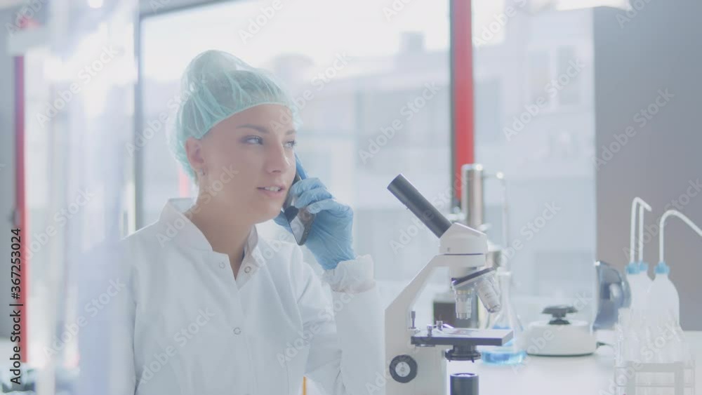 This video features a doctor using a phone and calling a patient about their test results in the lab. Doctor is laughing at the end. This video features a doctor using a phone and calling a patient about their test results in the lab. Doctor is laughing at the end.
