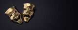 Golden theater masks of drama and comedy on a dark background (3D Rendering, illustration)