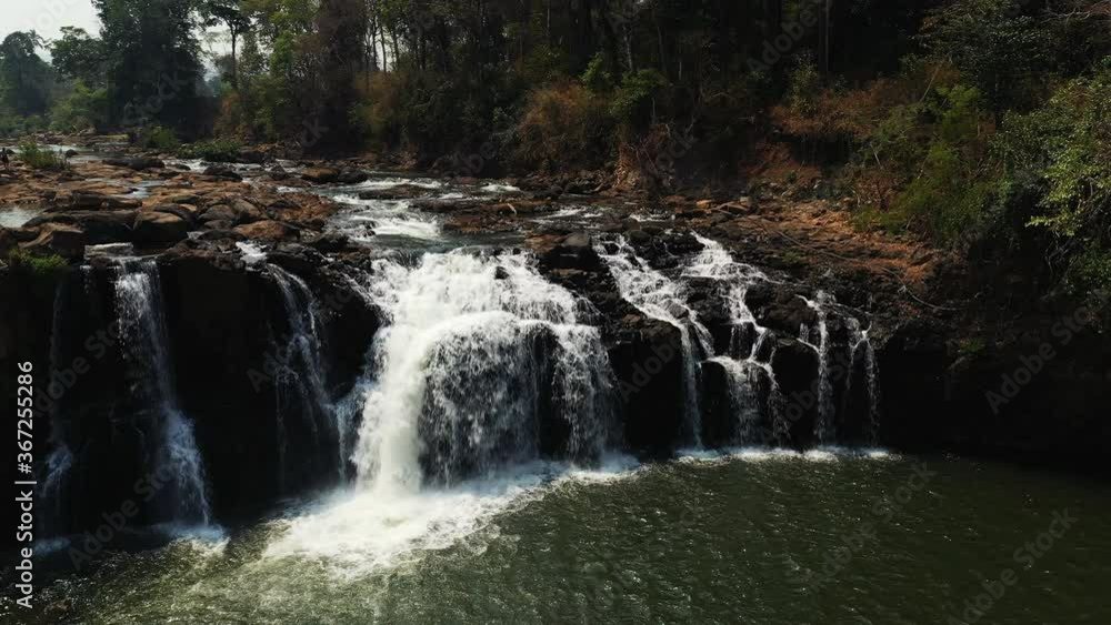 The rocky falls of Tad Lo in Asia, Laos, Champassak, on the Boloven plateau, on a sunny day. The rocky falls of Tad Lo in Asia, Laos, Champassak, on the Boloven plateau, on a sunny day.