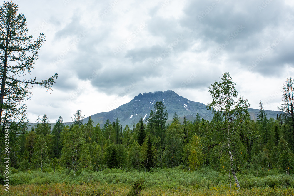 Amazing mountain landscape with colorful sky. Travel and hiking concept. Mountain landscape Subpolar Urals. Amazing mountain landscape with colorful sky. Travel and hiking concept. Mountain landscape Subpolar Urals.