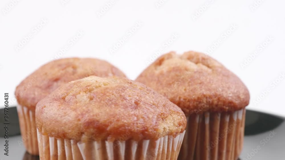 Muffins banana with white background shallow focus and slowly rotating. Muffins banana with white background shallow focus and slowly rotating.
