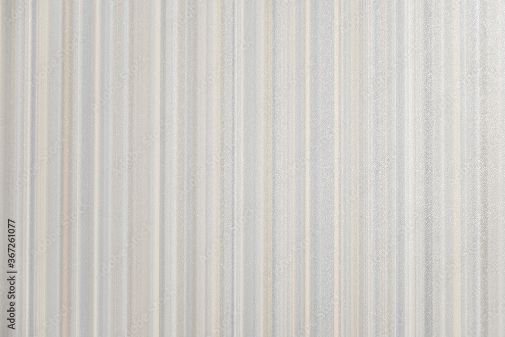 Furniture surface with vertical stripes in pastel colours, closeup view. Grey, blue, pink tender pastel colours.