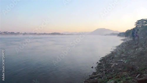 The landscape of the Mekong River in the morning in winter, mist from the rivers and mountains. And the beautiful landscape of the Mekong River. photo