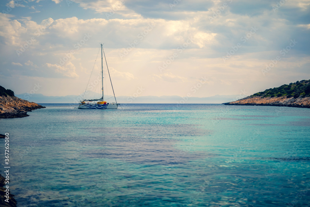 Sailing boat at distant remote island paradise with exotical vivid colors. Sailing boat at distant remote island paradise with exotical vivid colors.