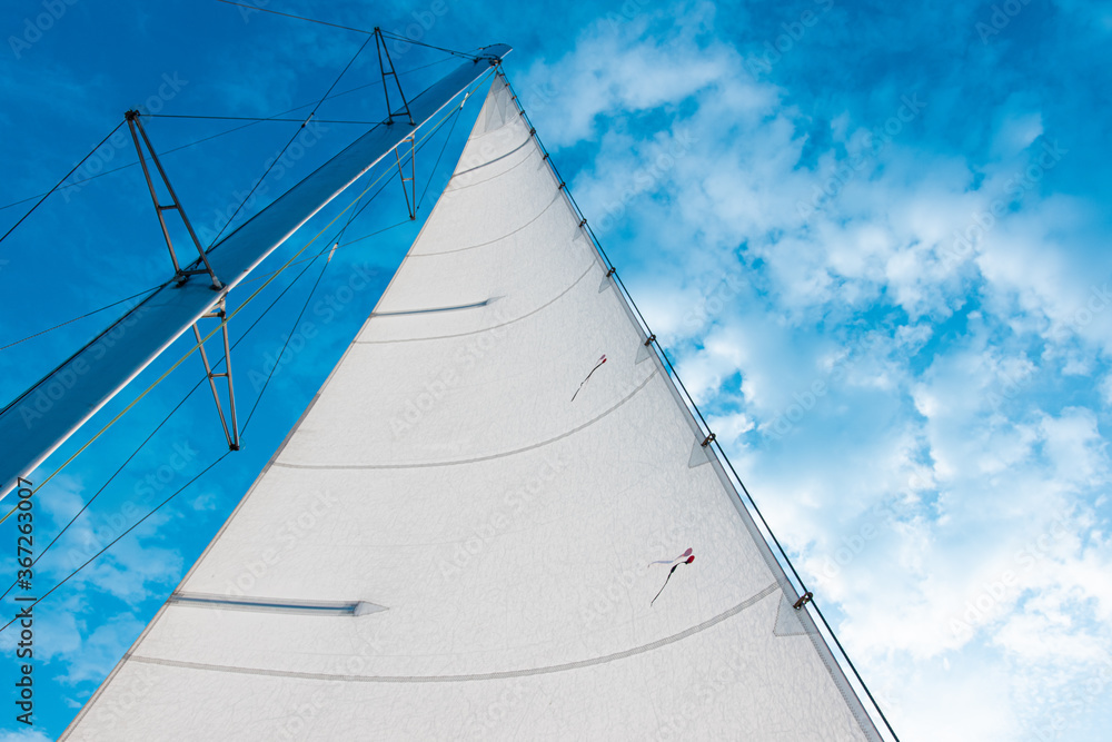 Looking up at sail boat mast and rigging