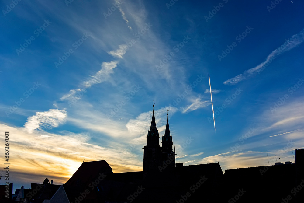 Silhouette of a gothic cathedral on a background of morning blue sky.