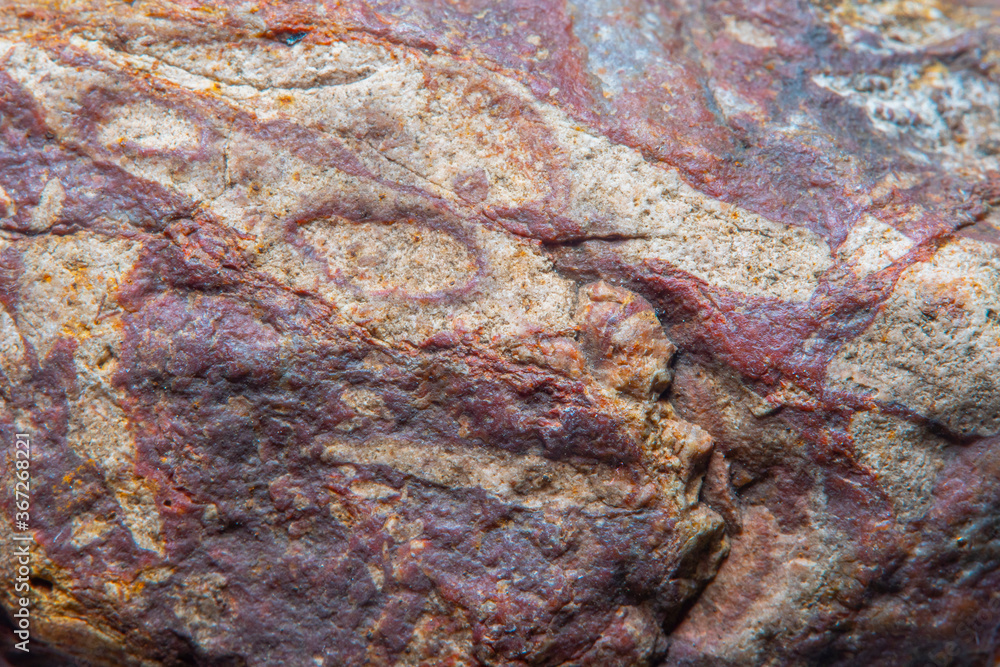 Blurred when heavily magnified, with a fine granite texture. Soft colors and fine details of the texture are not visible to the naked eye.