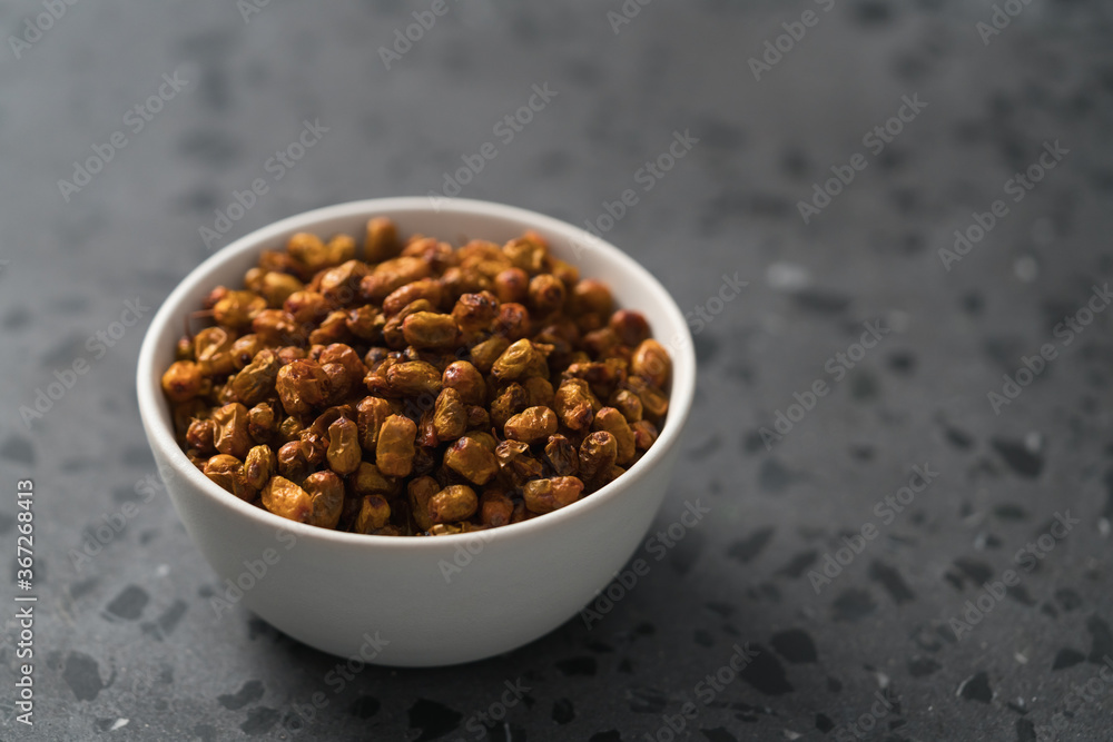 dried seaberry buckthorn in white bowl on terrazzo countertop with copy space dried seaberry buckthorn in white bowl on terrazzo countertop with copy space