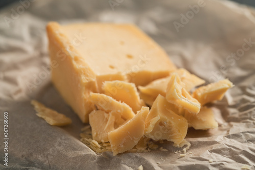 pieces of aged hard cheese on paper