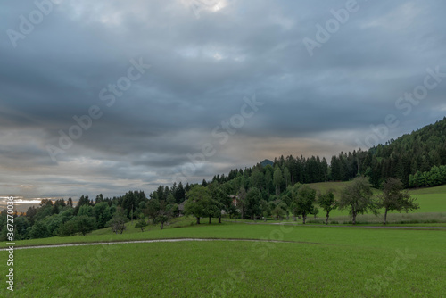 Cloudy Mittagskogel hill in summer fresh blue sky morning