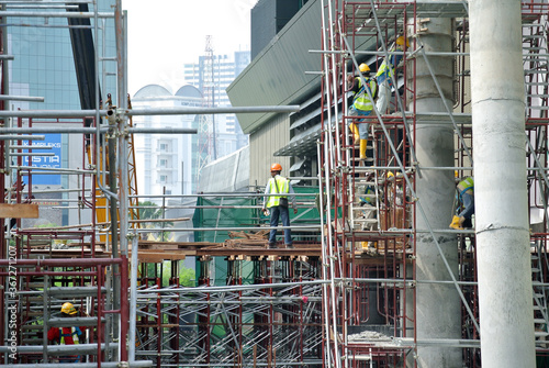 JOHOR, MALAYSIA -APRIL 13, 2016: Scaffolding used as the temporary structure to support platform, form work and structure at the construction site. Also used it as a walking platform for workers. 
