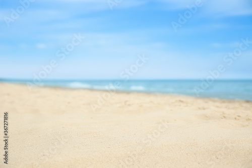 Beautiful sandy beach and sea on sunny day, closeup. Summer vacation