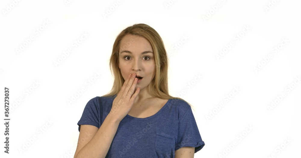 Young shocked woman looking on camera and covering her mouth Young shocked woman looking on camera and covering her mouth