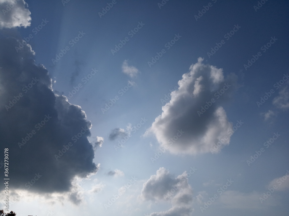 beautiful image of blue sky and lighting of sun on white clouds