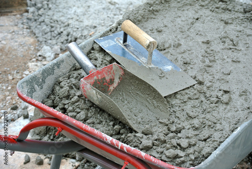 Canvas Print MALACCA, MALAYSIA – FEBRUARY 05, 2016: Fresh wet concrete is poured in the wheel
