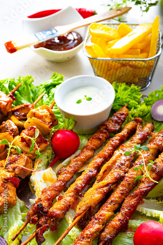 Grilled szaszlyk and meat flares with green salad photo