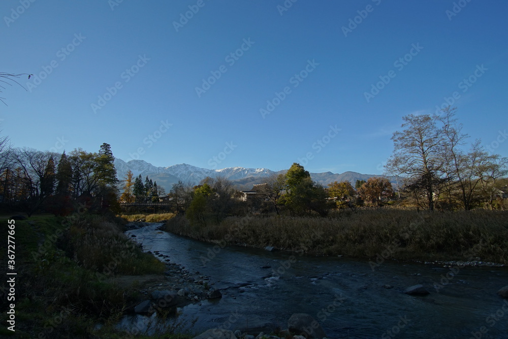 autumn landscape with river in the mountains of Japanese alps autumn landscape with river in the mountains of Japanese alps