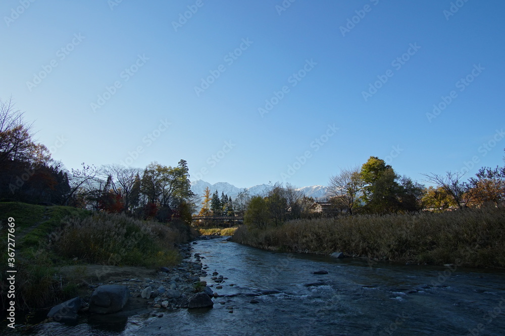 autumn landscape with river in the mountains of Japanese alps autumn landscape with river in the mountains of Japanese alps