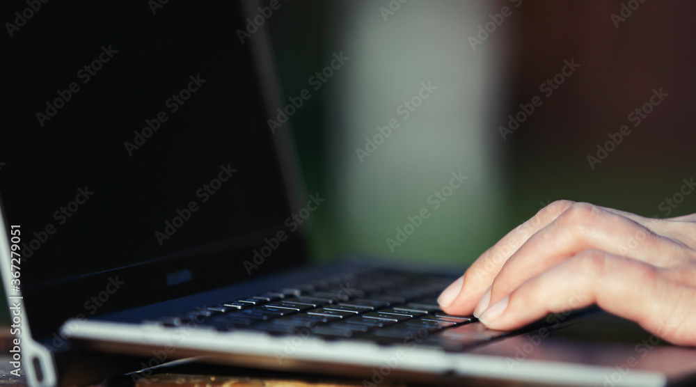 Working on laptop, hand, close-up Working on laptop, hand, close-up