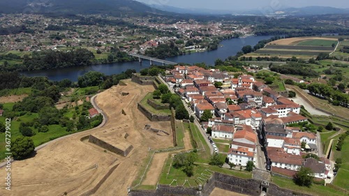 DRONE  AERIAL FOOTAGE: Fortress of Valenca do Minho in Portugal. Valença is a walled town located on the left bank of Minho River. The fortress is a piece of gothic and baroque military architecture. photo