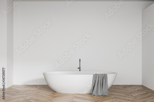 White bathroom interior with bathtub