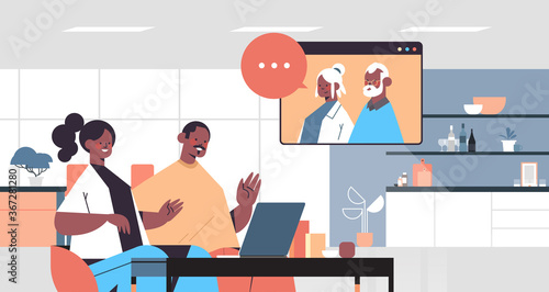 young couple having virtual meeting with grandparents during video call family chat online communication concept kitchen interior portrait horizontal vector illustration