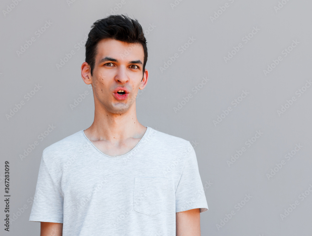 Portrait of shocked male says wow, looks bugged eyes and rounded mouth, being amazed to see something unexpected. Terrified guy with surpised expression. Emotions concept Portrait of shocked male says wow, looks bugged eyes and rounded mouth, being amazed to see something unexpected. Terrified guy with surpised expression. Emotions concept