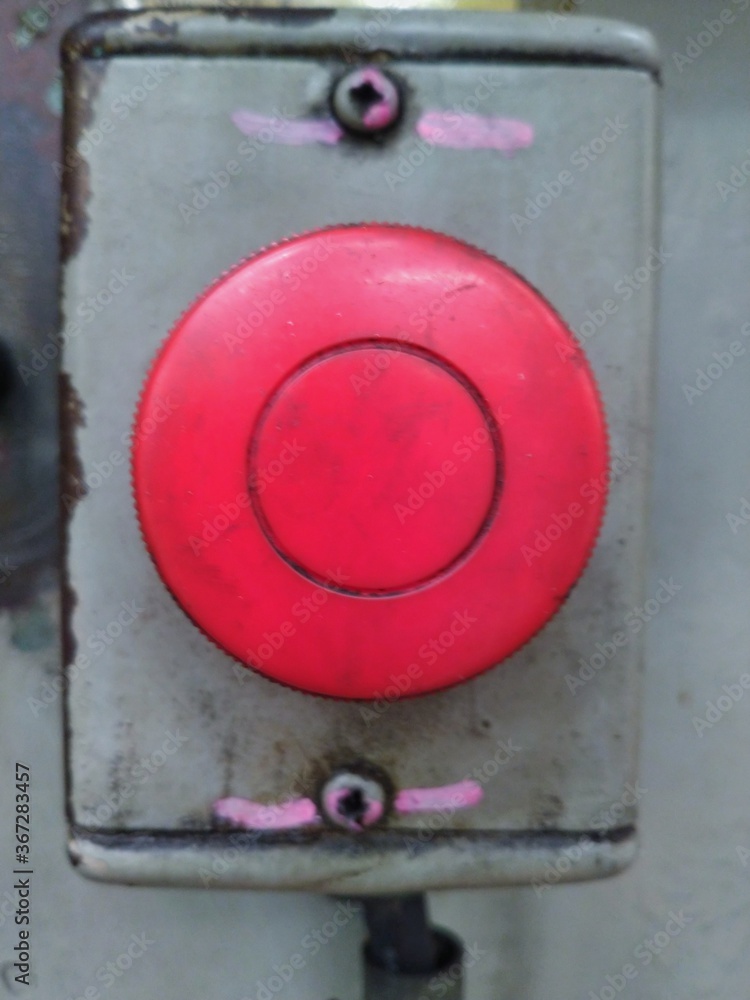 The emergency button has been installed on the machine for many years until it looks old. The emergency button has been installed on the machine for many years until it looks old.