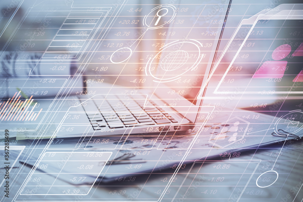 Obraz premium Double exposure of laptop computer and technology theme hologram. Concept of freelance work.