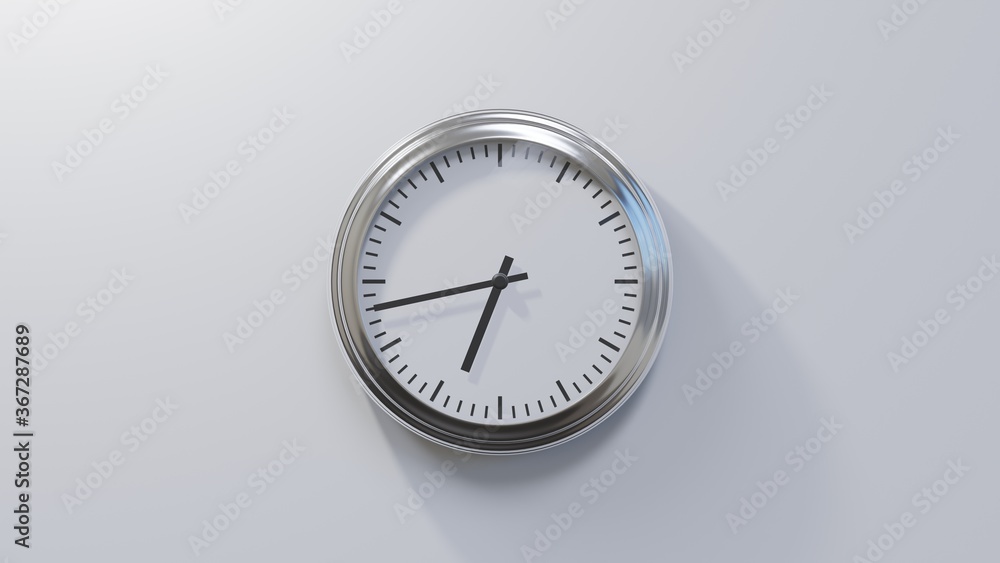 Glossy chrome clock on a white wall at forty-three past six. Time is 06:43 or 18:43 Glossy chrome clock on a white wall at forty-three past six. Time is 06:43 or 18:43