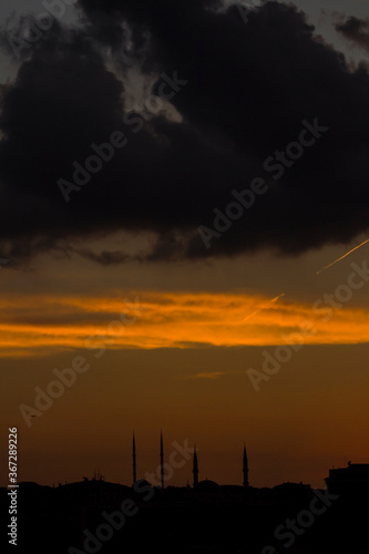 Sunset sky with dark shadow of city,close up taken.