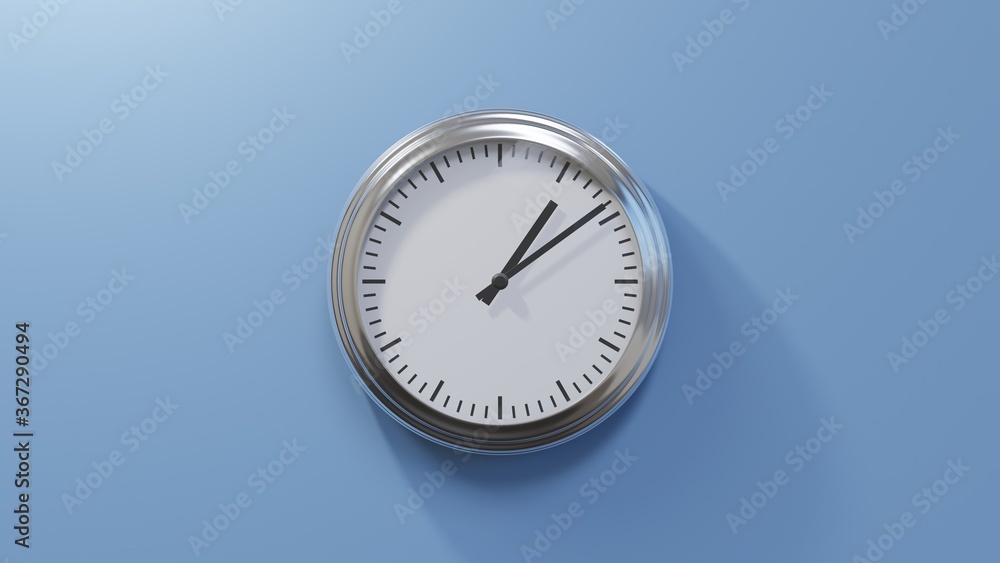Glossy chrome clock on a blue wall at nine past one. Time is 01:09 or 13:09 Glossy chrome clock on a blue wall at nine past one. Time is 01:09 or 13:09