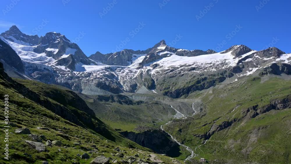 Scenic View Of The Trift Valley Surrounded By Alpine Summits And Glacier In Zermatt, Switzerland - static shot Scenic View Of The Trift Valley Surrounded By Alpine Summits And Glacier In Zermatt, Switzerland - static shot