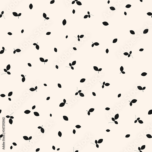 Vector monochrome seamless pattern with small scattered leaves. Simple minimal botanical background. Black and white wallpapers. Leaf texture. Repeat design for decor, wrapping, print, cloth, textile © Olgastocker
