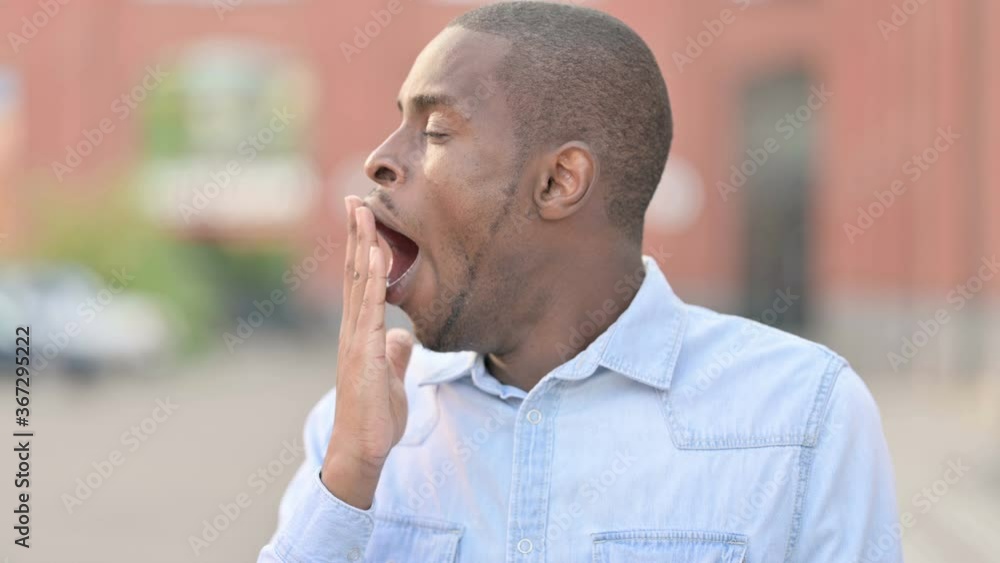 Tired African Man Sleeping Outdoor on Bench Tired African Man Sleeping Outdoor on Bench