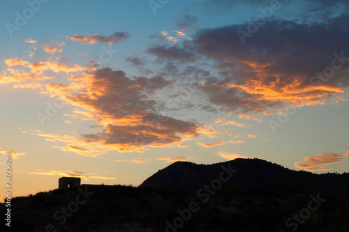 spectacular twilight with the sun hidden in the clouds