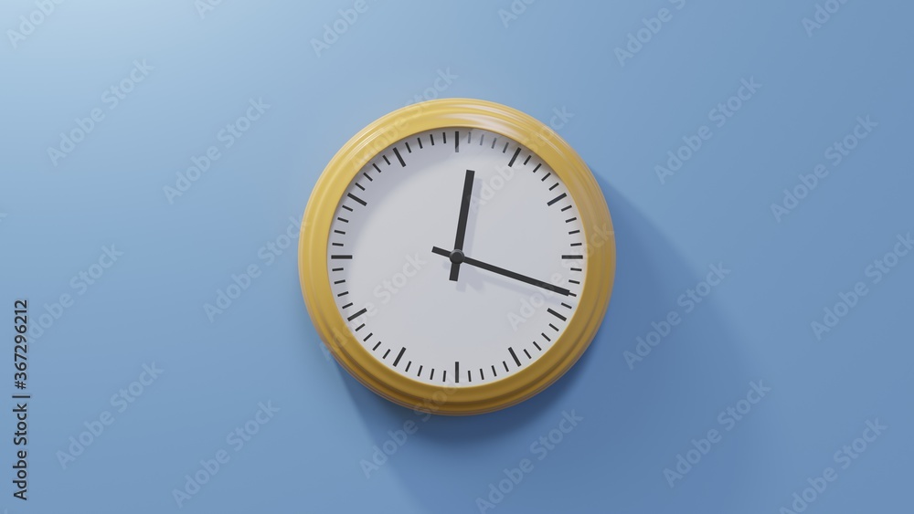 Glossy orange clock on a blue wall at eighteen past twelve. Time is 00:18 or 12:18 Glossy orange clock on a blue wall at eighteen past twelve. Time is 00:18 or 12:18