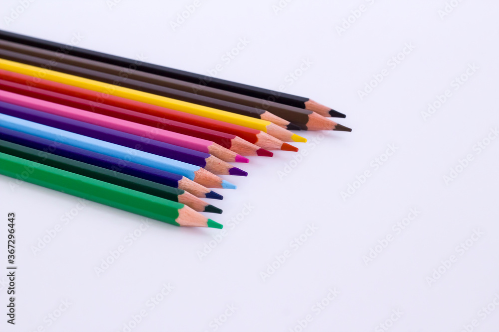 Twelve colored dry crayons on white background with copy space.Education Concept