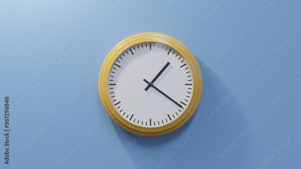 Glossy orange clock on a blue wall at twenty-one past one. Time is 01:21 or 13:21 Glossy orange clock on a blue wall at twenty-one past one. Time is 01:21 or 13:21