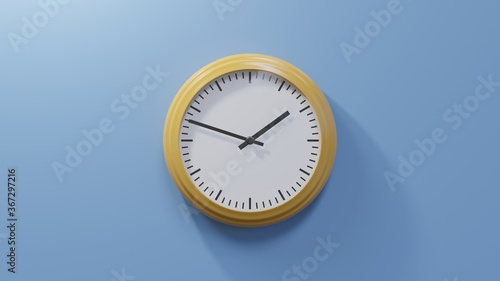 Glossy orange clock on a blue wall at forty-eight past one. Time is 01:48 or 13:48