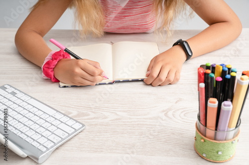 Girl hands doing studying at homeGirl hands studying at home and doing homework photo