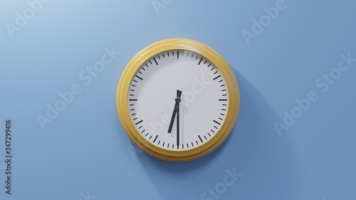 Glossy orange clock on a blue wall at half past six. Time is 06:30 or 18:30