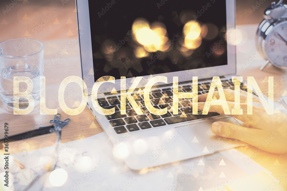 Blockchain theme hologram with man working on computer on background. Concept of crypto chain. Double exposure. Blockchain theme hologram with man working on computer on background. Concept of crypto chain. Double exposure.