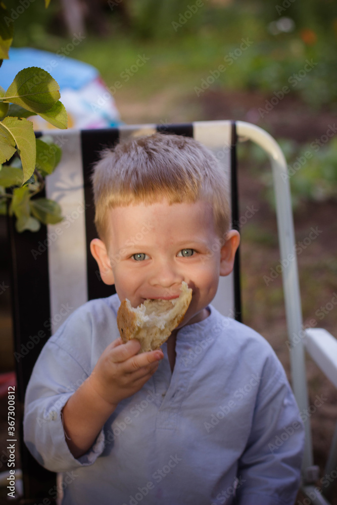 little boy eating a sandwich little boy eating a sandwich