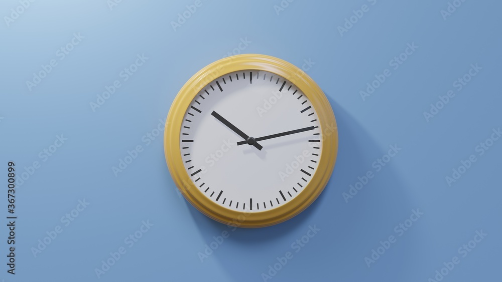 Glossy orange clock on a blue wall at thirteen past ten. Time is 10:13 or 22:13 Glossy orange clock on a blue wall at thirteen past ten. Time is 10:13 or 22:13