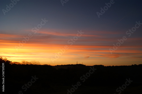 Beautiful sunrise through a blue sky