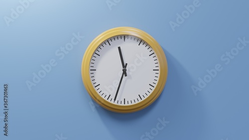 Glossy orange clock on a blue wall at thirty-three past eleven. Time is 11:33 or 23:33