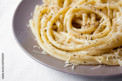 Spaghetti with cheese and pepper close-up