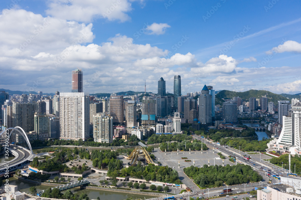 Aerial view of modern city and mountains